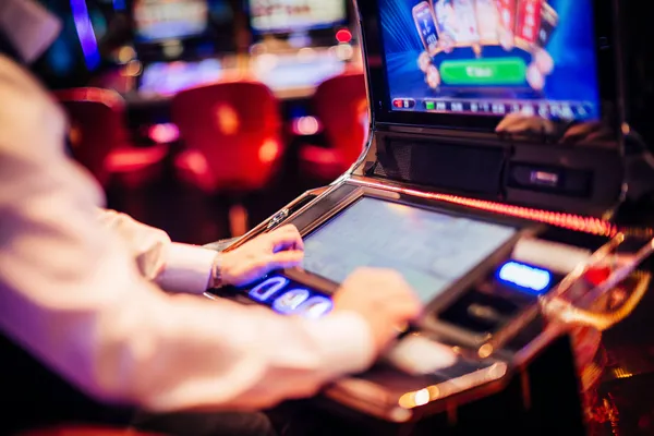 A young woman relaxing with her phone while dynamic casino elements float around her, illustrating the smooth mobile experience offered by the 9SL app.