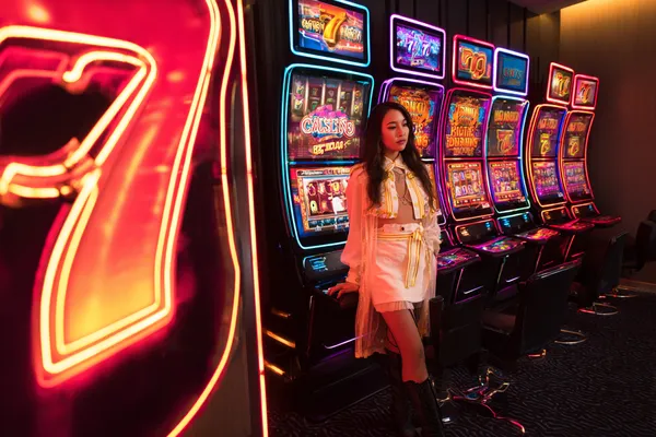 A confident dealer surrounded by casino chips inviting players to access their 9SL account, reflecting quick and easy login options.